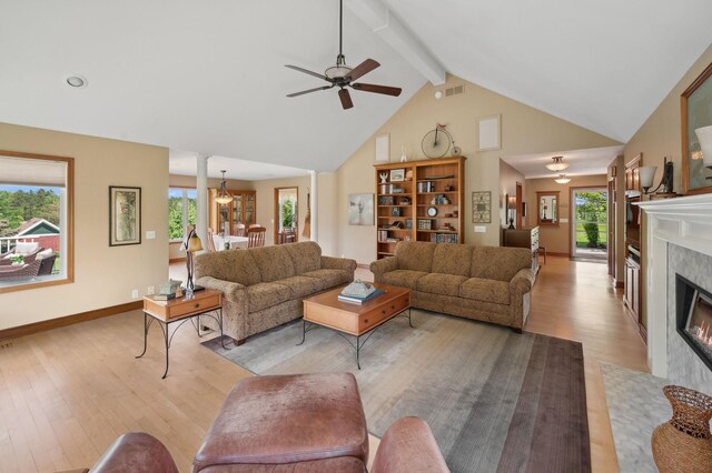 5191 Christen Ave NE, Buffalo, MN 55313 - living area with beamed ceiling, ceiling fan, high vaulted ceiling, and light wood-style floors