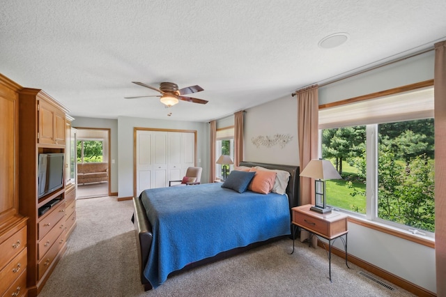 5191 Christen Ave NE, Buffalo, MN 55313 - bedroom with visible vents, light carpet, a ceiling fan, a closet, and baseboards