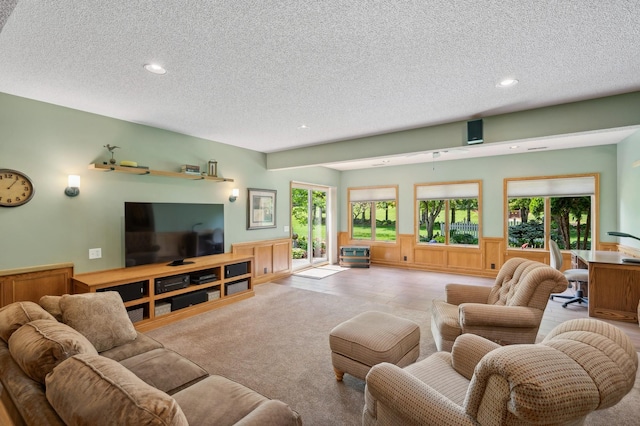 5191 Christen Ave NE, Buffalo, MN 55313 - carpeted living room with a textured ceiling, recessed lighting, and wainscoting