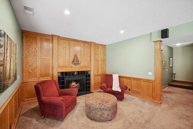 5191 Christen Ave NE, Buffalo, MN 55313 - sitting room featuring visible vents, light colored carpet, wainscoting, a tile fireplace, and recessed lighting