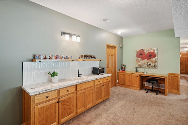 5191 Christen Ave NE, Buffalo, MN 55313 - interior space with light carpet, a sink, stainless steel microwave, open shelves, and light countertops