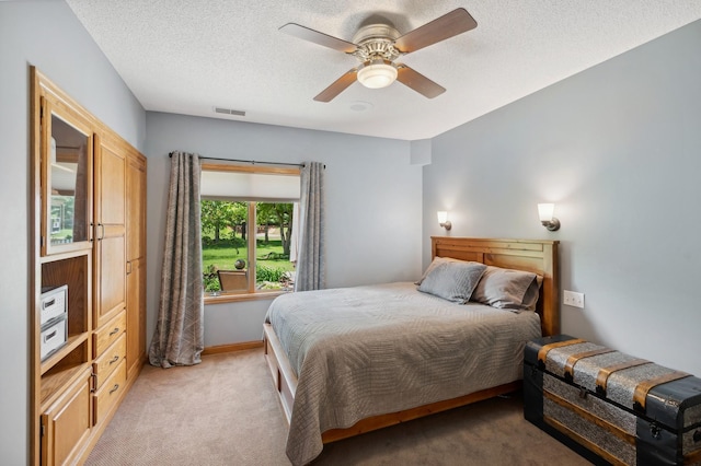 5191 Christen Ave NE, Buffalo, MN 55313 - bedroom with light carpet, visible vents, a textured ceiling, and ceiling fan