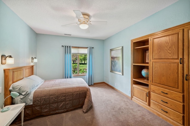 5191 Christen Ave NE, Buffalo, MN 55313 - bedroom with a ceiling fan, baseboards, visible vents, a textured ceiling, and light colored carpet