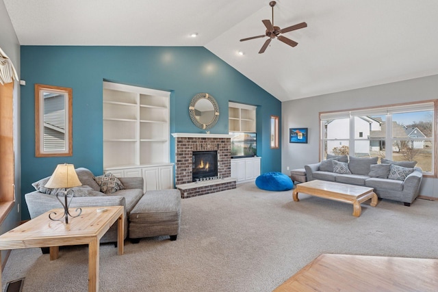 living area featuring built in features, carpet, visible vents, and ceiling fan