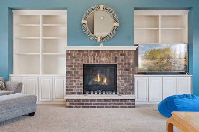 living area featuring a fireplace and carpet floors