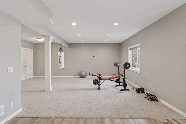 workout area with recessed lighting, baseboards, and wood finished floors