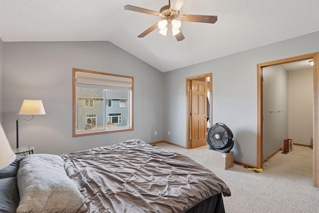 bedroom featuring light carpet, baseboards, and lofted ceiling