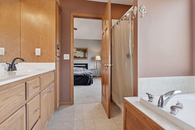 bathroom with tile patterned floors, a shower stall, a bath, and ensuite bathroom