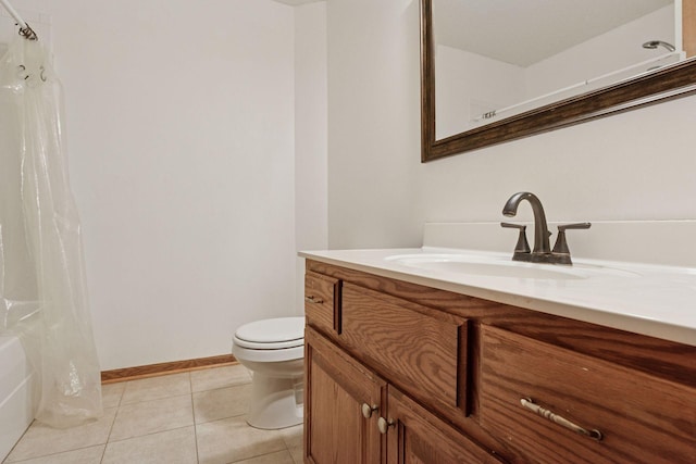 bathroom featuring vanity, baseboards, tile patterned flooring, curtained shower, and toilet