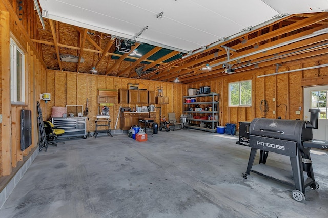 garage featuring a workshop area and a garage door opener