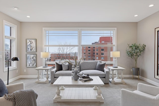 living area with carpet flooring, recessed lighting, and baseboards