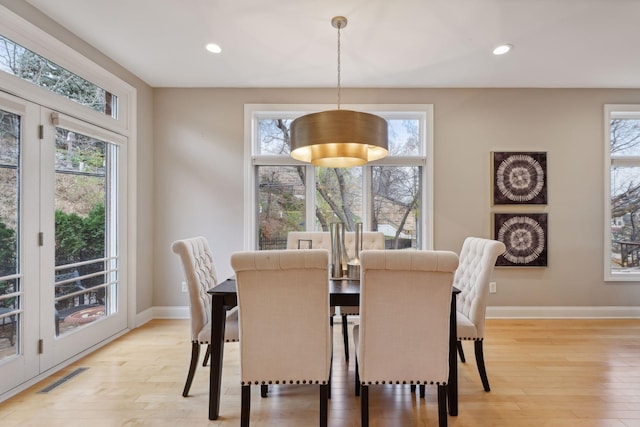 dining space with recessed lighting, visible vents, baseboards, and light wood-style floors