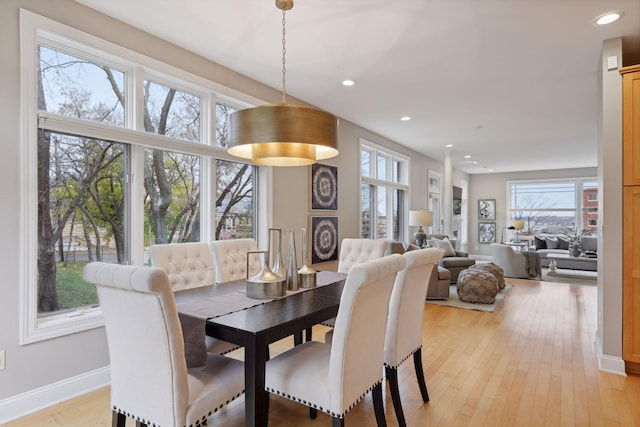 dining room featuring recessed lighting, light wood-type flooring, and baseboards