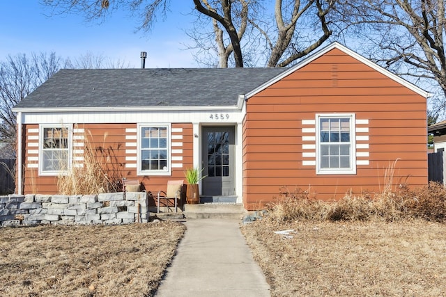 ranch-style house with roof with shingles