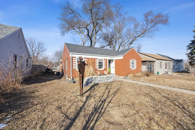 view of front of house featuring fence