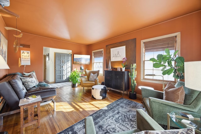 living area with wood finished floors and visible vents