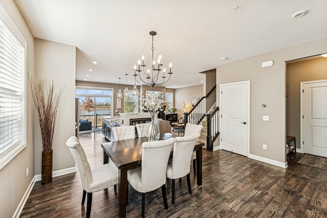 dining area with stairway, baseboards, dark wood-style flooring, and a chandelier