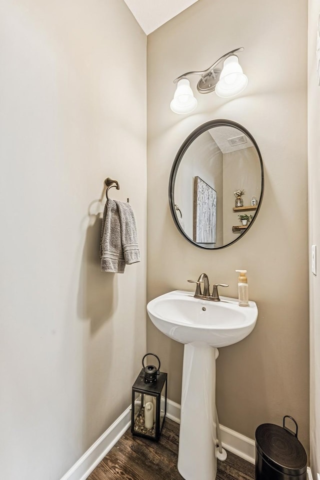 bathroom featuring baseboards and wood finished floors