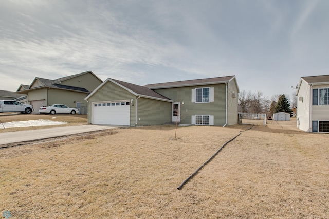 view of front facade with a garage and concrete driveway