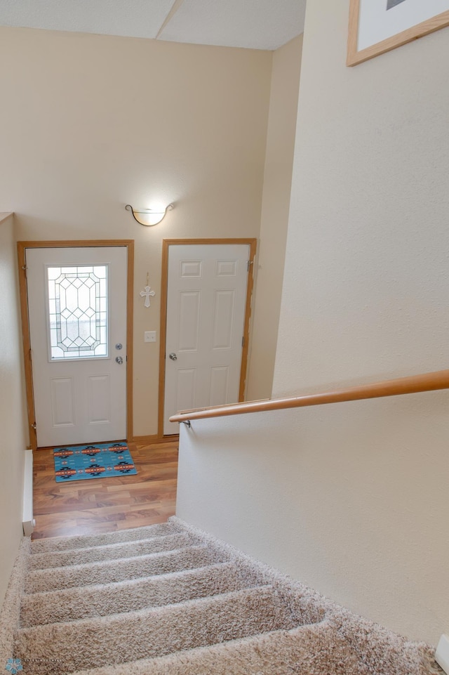 staircase with wood finished floors