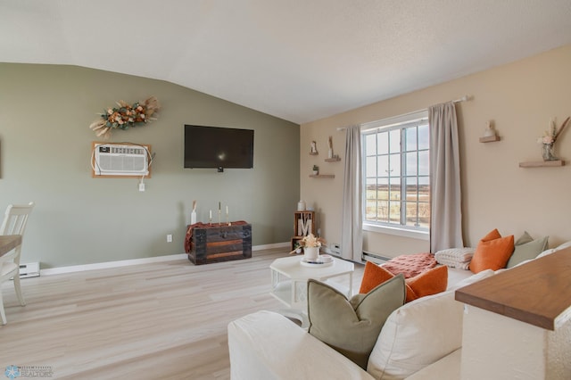 living area featuring a baseboard heating unit, wood finished floors, a wall unit AC, baseboards, and vaulted ceiling