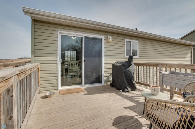 wooden terrace with area for grilling