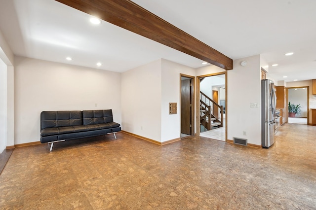 sitting room featuring visible vents, baseboards, recessed lighting, stairs, and beamed ceiling