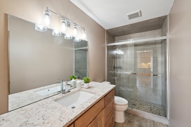 full bathroom featuring visible vents, a stall shower, toilet, and vanity