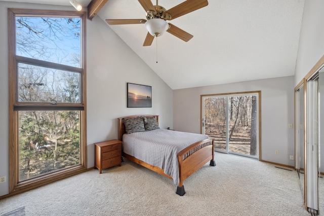 carpeted bedroom with access to exterior, visible vents, baseboards, high vaulted ceiling, and a ceiling fan