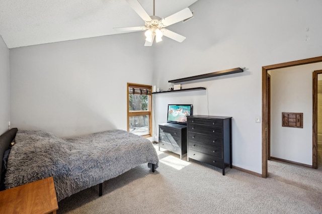 bedroom featuring carpet flooring, a ceiling fan, baseboards, and vaulted ceiling