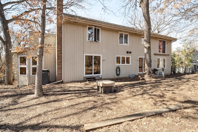 rear view of house with central AC