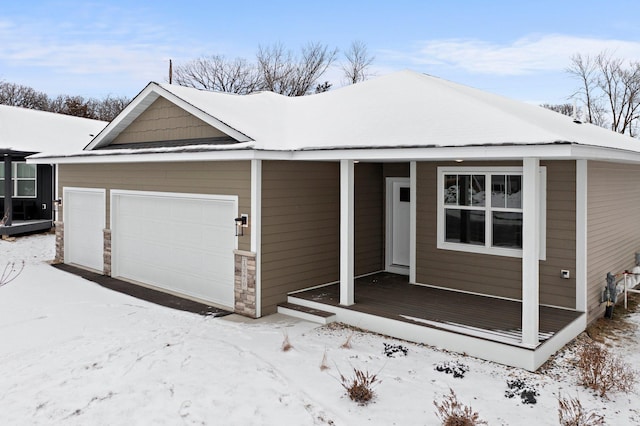 view of front of house with a garage and stone siding