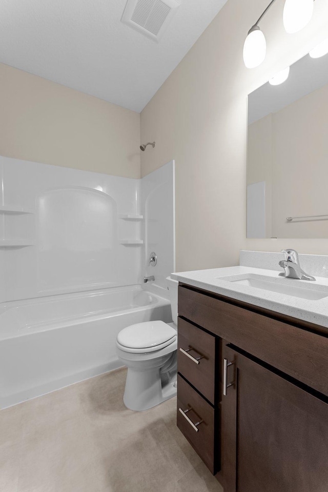 bathroom with visible vents, bathing tub / shower combination, vanity, and toilet