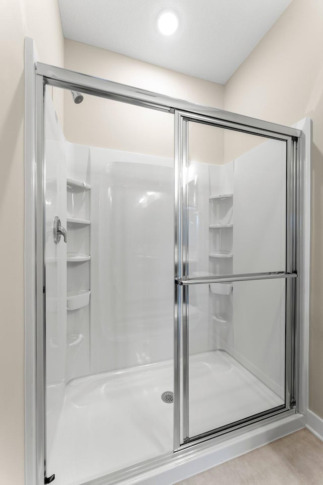 bathroom with a stall shower