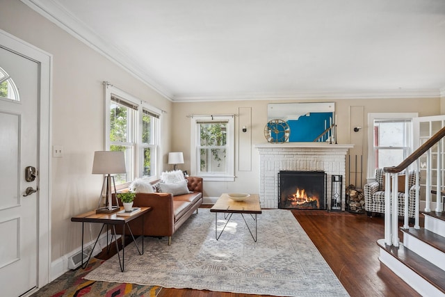 5026 Nokomis Ave, Minneapolis, MN 55417 - living room featuring ornamental molding, wood finished floors, a brick fireplace, stairs, and baseboards