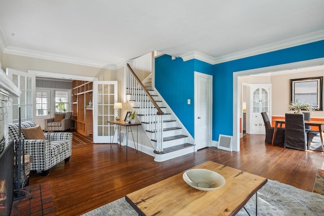 5026 Nokomis Ave, Minneapolis, MN 55417 - living room with french doors, ornamental molding, stairs, wood finished floors, and baseboards