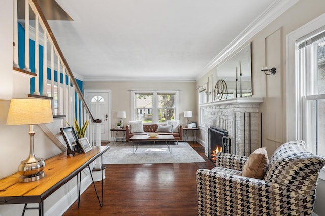 5026 Nokomis Ave, Minneapolis, MN 55417 - living area featuring a fireplace, wood finished floors, stairs, crown molding, and baseboards