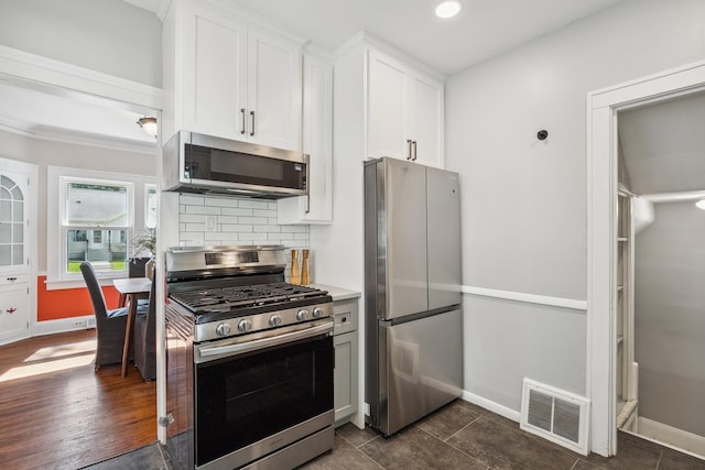 5026 Nokomis Ave, Minneapolis, MN 55417 - kitchen with appliances with stainless steel finishes, baseboards, white cabinets, tasteful backsplash, and recessed lighting
