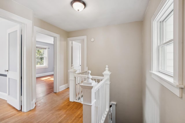 5026 Nokomis Ave, Minneapolis, MN 55417 - hallway with an upstairs landing, light wood-style floors, and baseboards