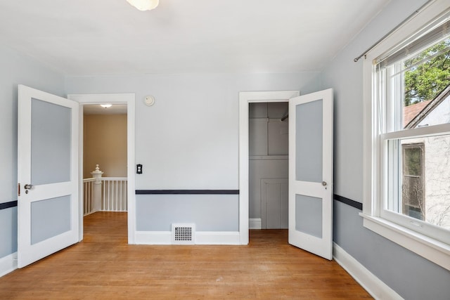 5026 Nokomis Ave, Minneapolis, MN 55417 - unfurnished bedroom with wood finished floors and baseboards
