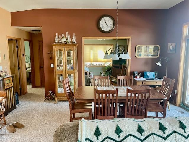 dining area featuring carpet