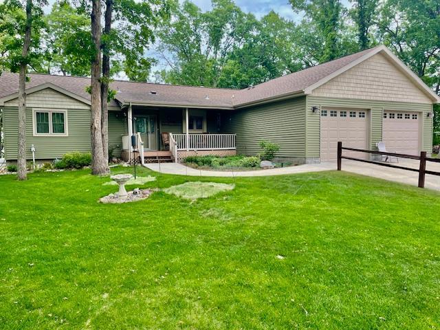 26909 Lake Ethel Rd, Girard Twp, MN 56515 - ranch-style house with a front yard, an attached garage, and covered porch