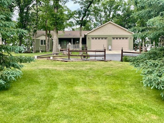 26909 Lake Ethel Rd, Girard Twp, MN 56515 - view of grassy yard featuring an attached garage