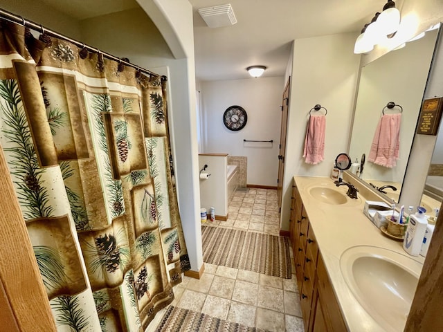 26909 Lake Ethel Rd, Girard Twp, MN 56515 - full bath with double vanity, a bath, baseboards, and a shower with shower curtain