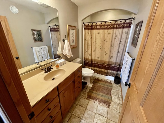 26909 Lake Ethel Rd, Girard Twp, MN 56515 - bathroom with toilet, vanity, and stone finish floors