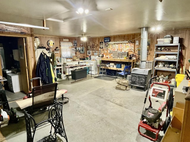 26909 Lake Ethel Rd, Girard Twp, MN 56515 - below grade area featuring wooden walls and a workshop area