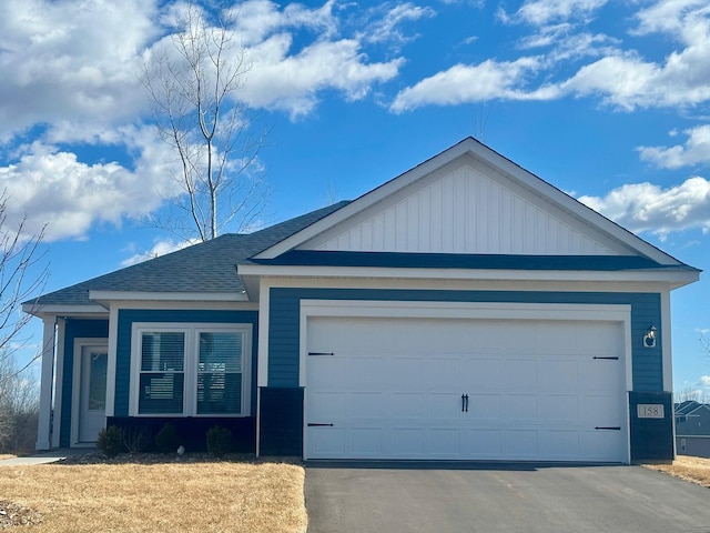 158 Summerfield Dr, Waverly, MN 55390 - ranch-style house featuring a garage, board and batten siding, driveway, and roof with shingles
