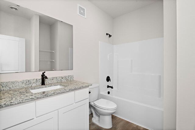 158 Summerfield Dr, Waverly, MN 55390 - bathroom featuring wood finished floors, vanity, and tub / shower combination