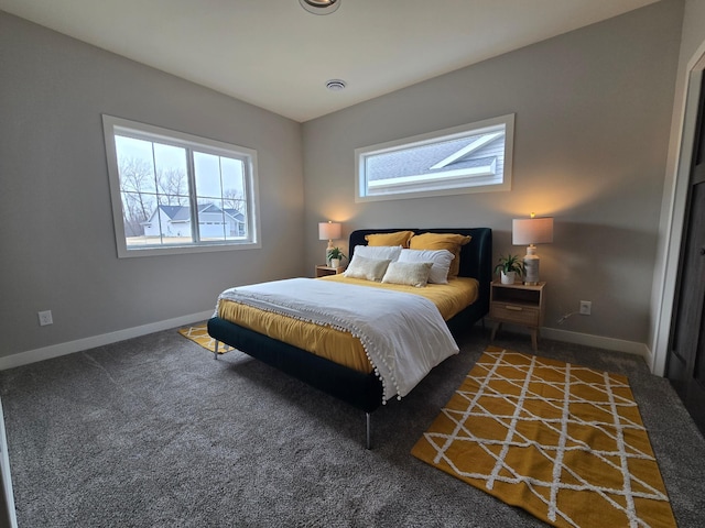 carpeted bedroom featuring visible vents and baseboards