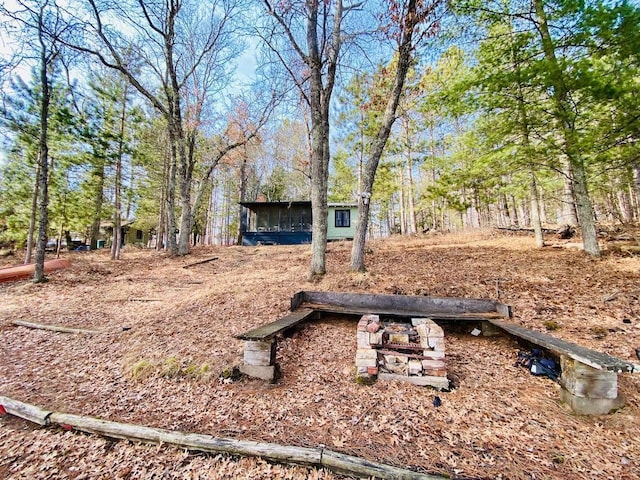 view of yard with an outdoor fire pit